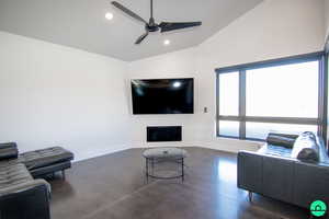 Living room with lofted ceiling and ceiling fan