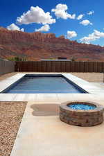 View of swimming pool featuring a mountain view and a patio