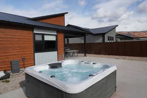 View of patio / terrace featuring a hot tub