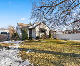 Bungalow-style home with a front yard