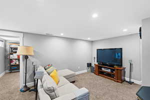 Living room featuring carpet floors