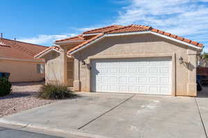 View of front of property featuring a garage