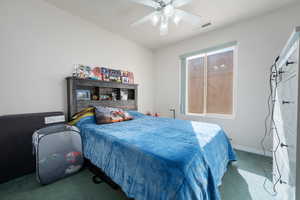 Carpeted bedroom with ceiling fan