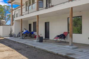 Back of house featuring a balcony