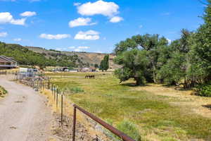 Property view of mountains featuring a rural view