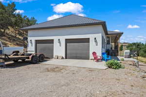 View of side of property featuring a garage