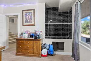 Interior details with a tiled fireplace