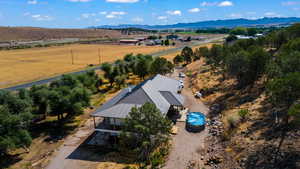 Drone / aerial view featuring a mountain view and a rural view