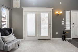 Sitting room featuring carpet flooring