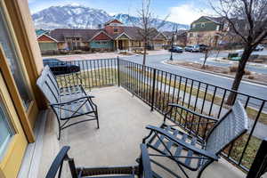 Balcony featuring a porch and a mountain view