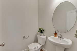 Bathroom featuring sink and toilet