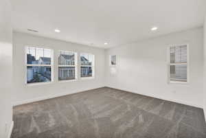 Unfurnished room featuring carpet flooring