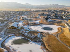 Snowy aerial view featuring a mountain view