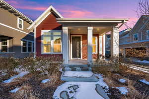 View of snow covered property entrance