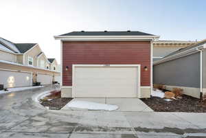 View of front of property with a garage