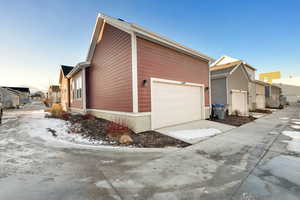 Property exterior at dusk with a garage