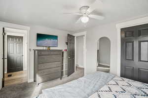 Bedroom featuring ceiling fan and light carpet