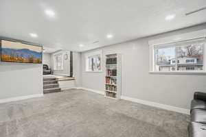 Unfurnished living room with carpet flooring