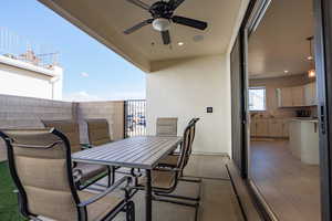 Balcony featuring ceiling fan