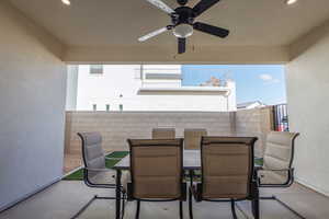 View of patio featuring ceiling fan