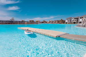 View of swimming pool featuring a water view