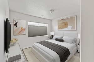 Bedroom featuring a textured ceiling