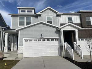 View of front of property with a garage