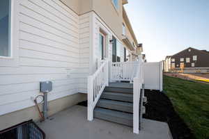 View of exterior entry featuring a yard