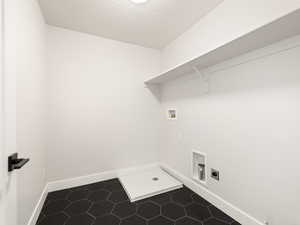 Laundry area featuring hookup for an electric dryer and washer hookup