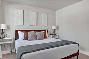 Bedroom with light colored carpet