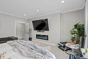 Bedroom featuring crown molding and carpet floors