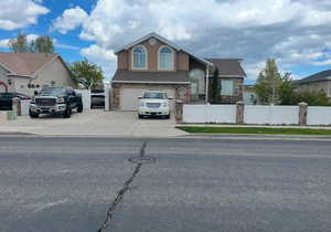 View of front of property featuring a garage