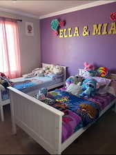 Carpeted bedroom featuring crown molding