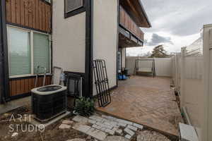 View of patio with central AC unit