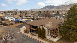 Birds eye view of property with a mountain view