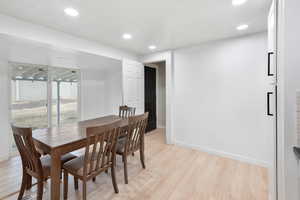 Dining area with light wood-type flooring