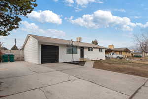 Ranch-style house featuring a garage