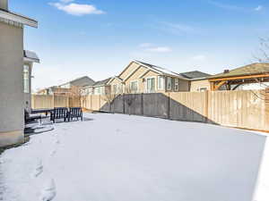 View of yard layered in snow