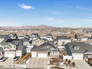 Birds eye view of property with a mountain view