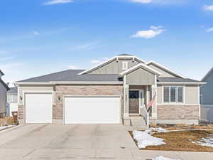View of front facade featuring a garage
