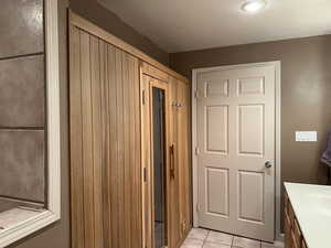 Hall with sink and light tile patterned floors