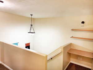 Hallway featuring carpet floors