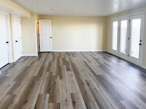 Interior space featuring wood finished floors and baseboards