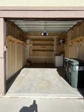 Garage featuring washer / clothes dryer and a garage door opener