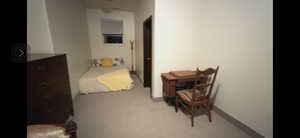 Bedroom featuring light colored carpet large bedroom with two closets