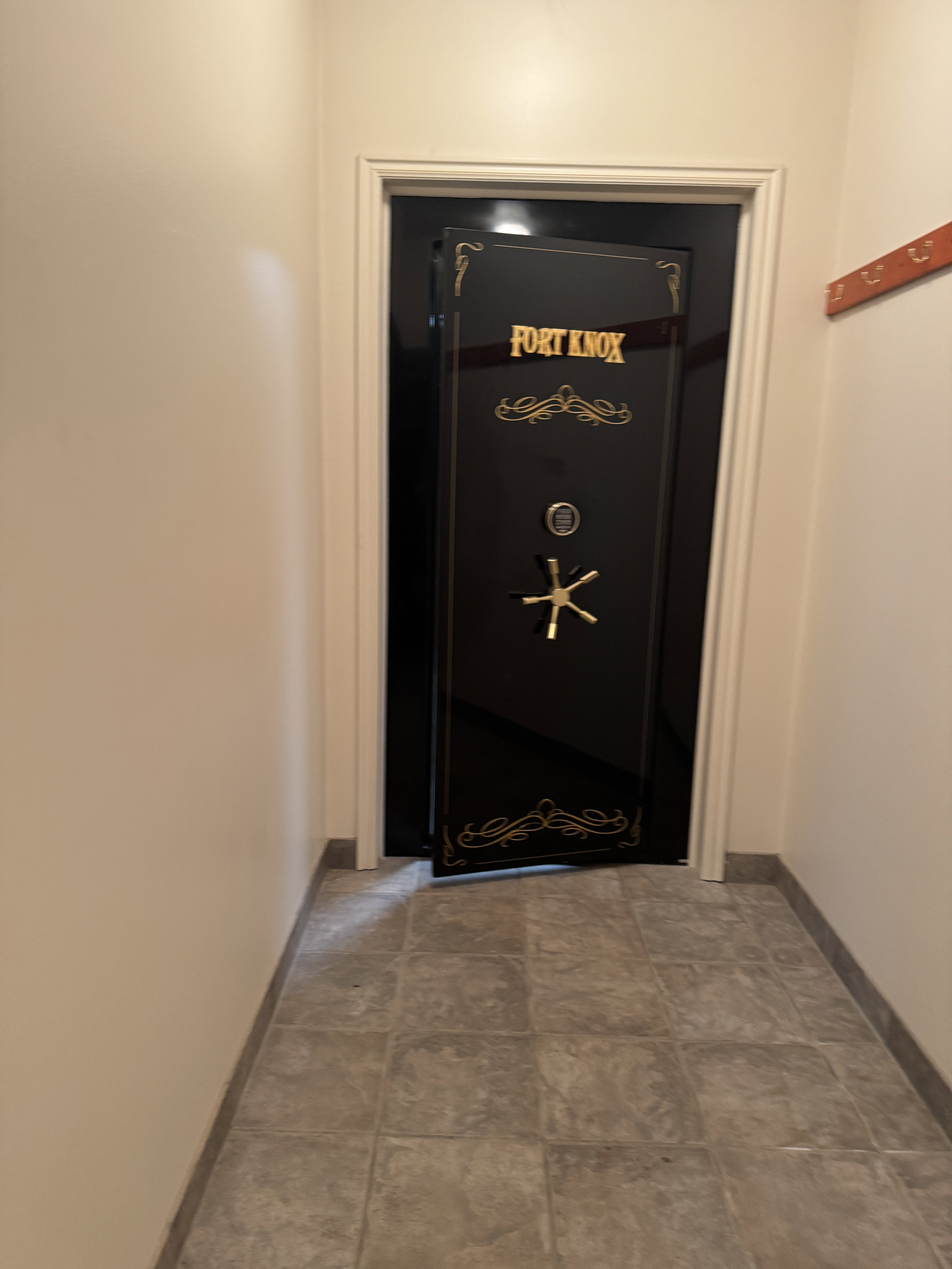 Entry to the 10' by 18' vault room-secure storage located in a mudroom entry that comes from the snowmobile garage.