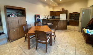 View of tiled bar great room with vaulted ceilings second kitchenseperate ice maker