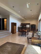 Living area featuring recessed lighting and light tile patterned flooring
