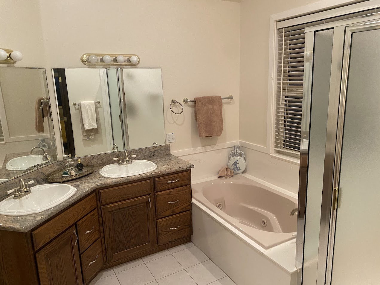 Primary Bathroom with jetted tub and shower and double sinks