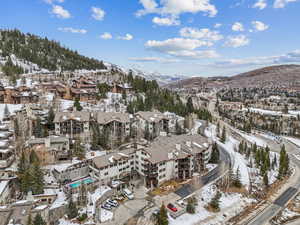 Snowy aerial view featuring a mountain view